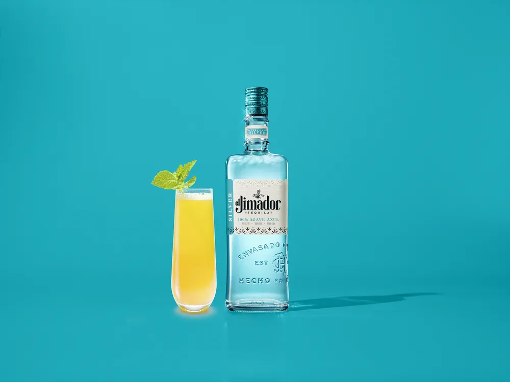 Mango Bellini with bottle of el Jimador Silver.